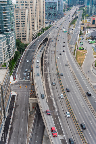 Gardiner Expressway Traffic in Downtown Toronto Canada - Elevated view of traffic on the Gardiner Expressway surrounded by high-rise buildings in downtown Toronto, Ontario, Canada.