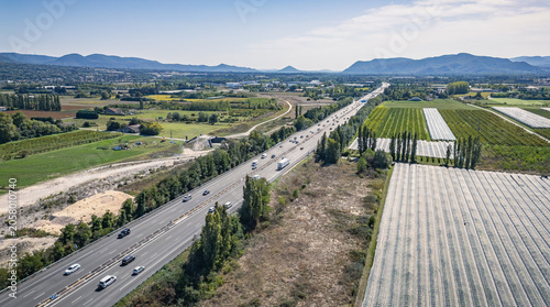 Aerial view of Autoroute A7 crossing agricultural fields in the Rhône Valley, Southern France
