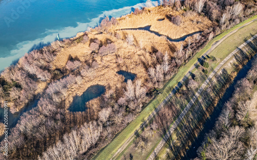 Abstract aerial pattern of wetlands and turquoise water along the Rhone River in France