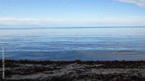The Calm Waters of a Lake Connect with a Stream to Reach the St. Lawrence River at Sunset in Grand Makasti, Anticosti Island, Quebec, Canada