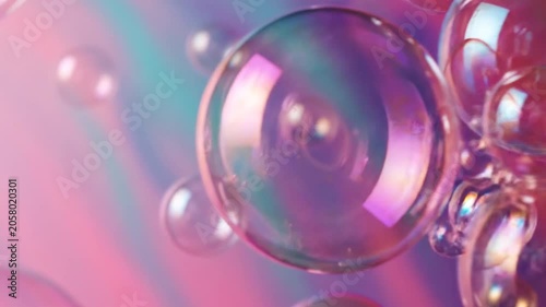 Abstract colorful soap bubbles floating in iridescent air.
