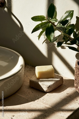 Soft sunlight bathes a minimalist bathroom scene