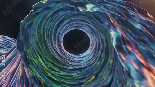 Abstract flowing blue and pink fabric on dark background