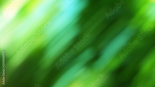 Obraz na plátně Abstract vibrant green blurred background with dynamic motion creating energetic