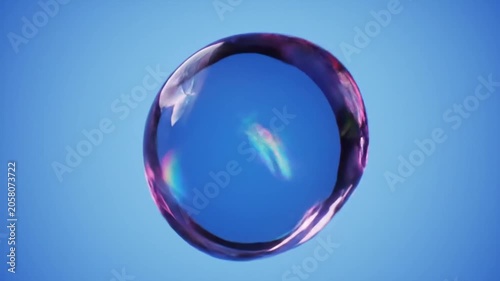Floating iridescent glass ring with rainbow light refraction.
