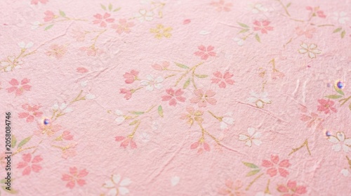 Soft Pink Background with Delicate Cherry Blossoms and Petals