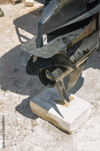 Vászonkép Detail of an outboard engine lower unit with propeller and skeg supported on a l