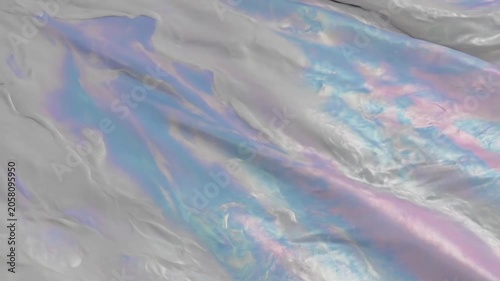 Iridescent holographic crumpled plastic texture background.