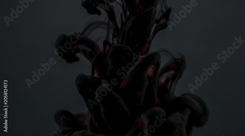 Close-up of a dark, abstract object with wavy tendrils against a dark background with a moody atmosphere.