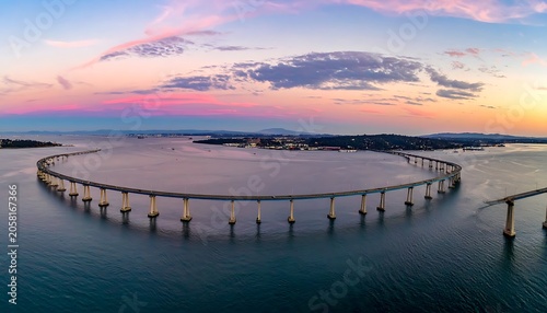 Aerial view of a circular bridge over water at sunset