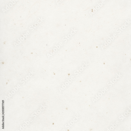 Fotografie White textured paper background with subtle speckles