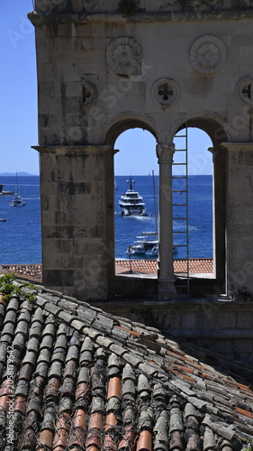 Gothic Church Bell Tower with Luxury Superyacht Through Arch, Adriatic Sea, Croatia