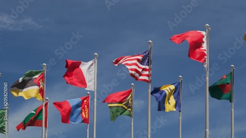 National flags of USA, Bahrain, Bangladesh, Barbados, Maldives, Mongolia, Mozambique, Vanuatu and other countries flying at Olympic Park in Seoul, South Korea