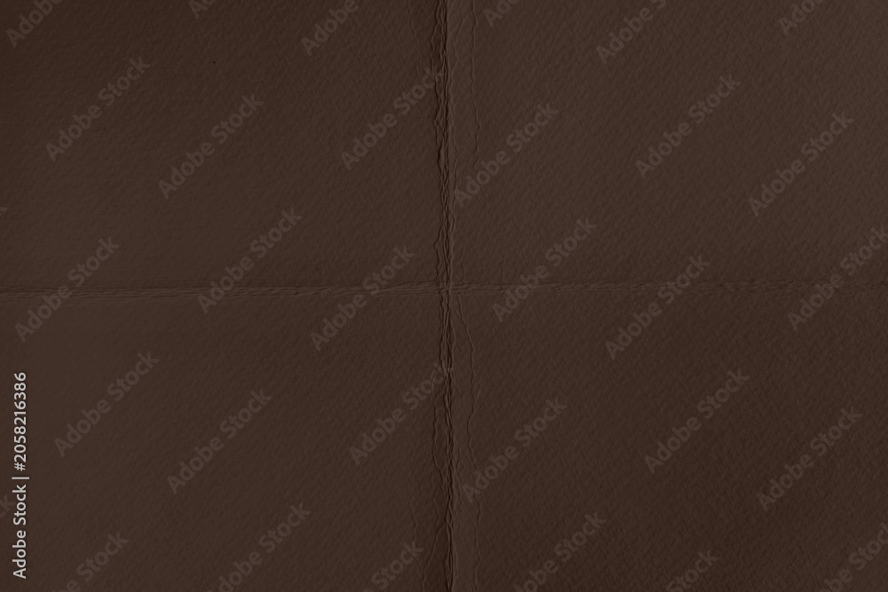 Fototapeta premium Dark brown textured paper background with subtle folds