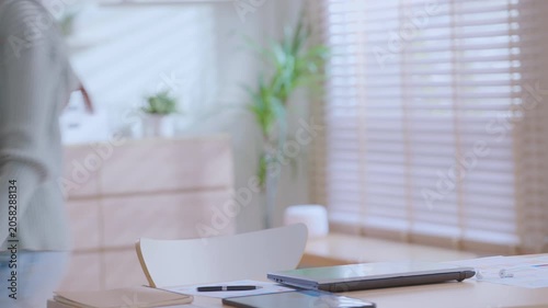 Happy relaxed Asian woman female home office worker girl. business woman finished online work end closing laptop computer take break relieve stress stretch indoor.