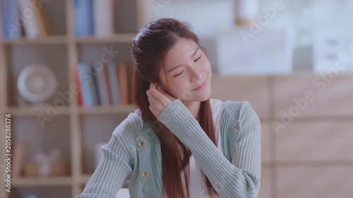 Happy relaxed Asian woman female home office worker girl. business woman finished online work end closing laptop computer take break relieve stress stretch indoor.