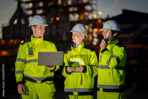 Photos Industrial worker safety hard hat high visibility night refinery laptop radio, e