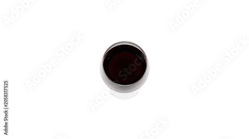 Glass of dark red wine isolated on white background top view.