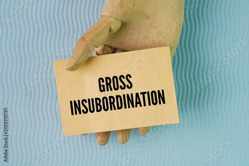 Fotografi Paper with the word gross insubordination