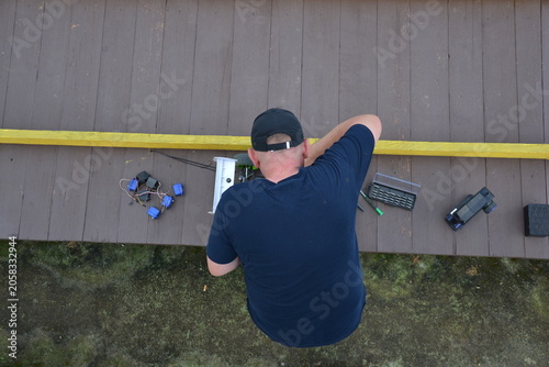 Photography Man Repairing Remote Control Car on pitstop