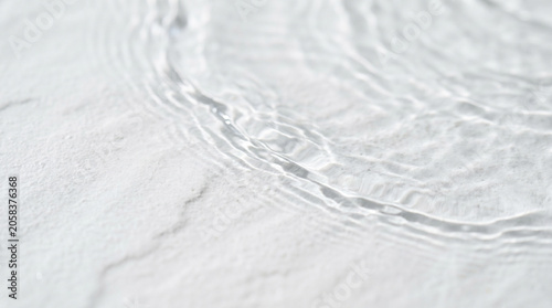 Clear Water Ripples on White Marble Surface Background