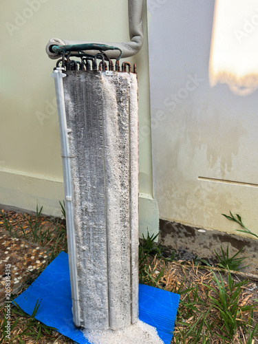 Realistic view of air conditioner coils covered with cleaning foam during maintenance. Ideal for HVAC services, industrial cleaning, equipment care, and technical marketing materials.