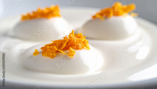 Creamy yogurt with floating citrus zest particles macro texture