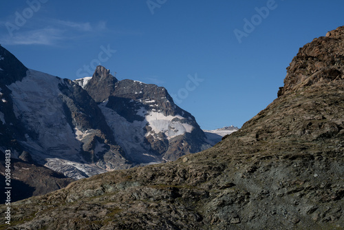 Switzerland, glacier and snowy mountain, with mountain peak, in summer, wilderness scene