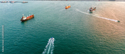 Cuadro en lienzo fast patrol boat with LPG gas and oil tanker ships anchored in the ocean, with a fast patrol boat in the foreground