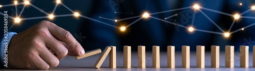 Business chain reaction leadership strategy and domino effect in risk management modern office environment close-up view