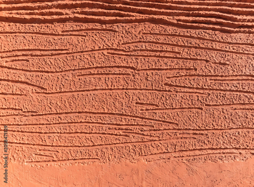 Fototapeta premium Textured terracotta wall background with horizontal linear pattern