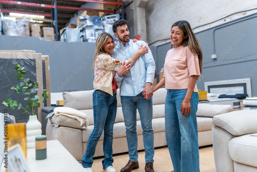 Obraz premium Family group shopping for new sofa in furniture store