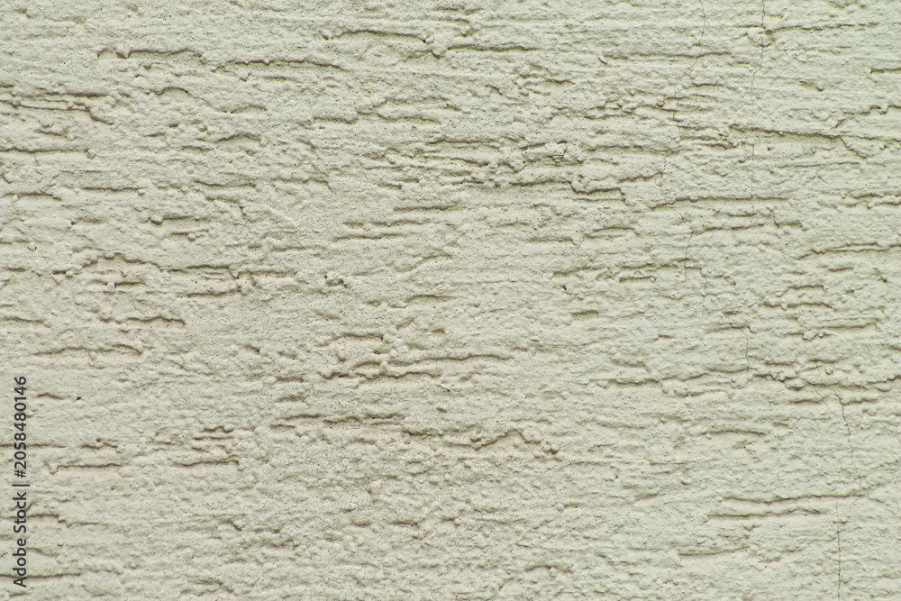 Fototapeta premium Rough beige plaster wall texture flat with cracks and horizontal ridges for construction, rebuilding, renovation and remodeling advertisement materials