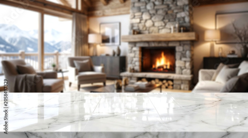 White marble table top with blurred luxury mountain lodge fireplace background for winter product showcase mockup