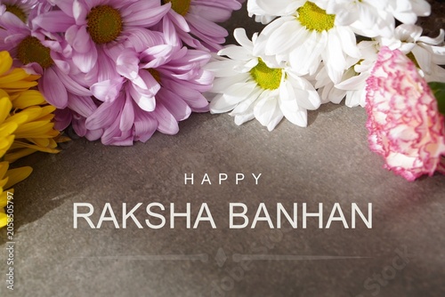 Konstfotografi happy raksha bandhan. greeting card with fresh flowers.