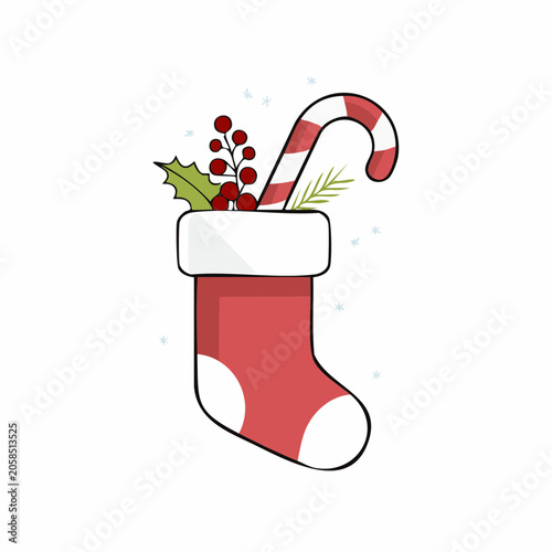 Christmas stocking filled with candy cane and holly berries