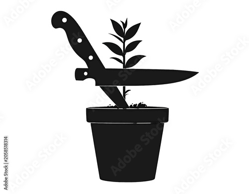 фотографія A plant in a pot is threatened by a sharp knife