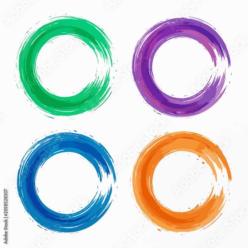 Four colorful circular brush strokes on a clean white background