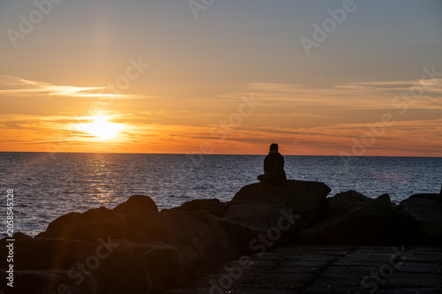 A figure in solitude at Sunset
