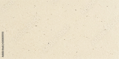 Warm beige kraft paper texture with natural specks for eco friendly packaging and rustic organic background
