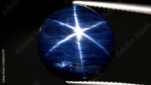 Sapphire crystal exhibiting a natural star pattern, gemstone close-up.