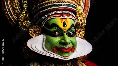 A detailed and colorful Kathakali dance mask with exaggerated expression.