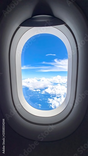 A view of clouds and sky from an airplane window