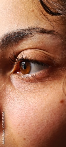 Obraz na płótnie Natural brown eye close-up with detailed eyelashes and skin texture