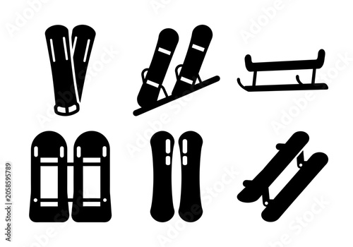 Foto Black winter sports and skiing equipment set - Flat design vector icons of skis, ski poles, snowboard, and sled for winter sports and skiing themes