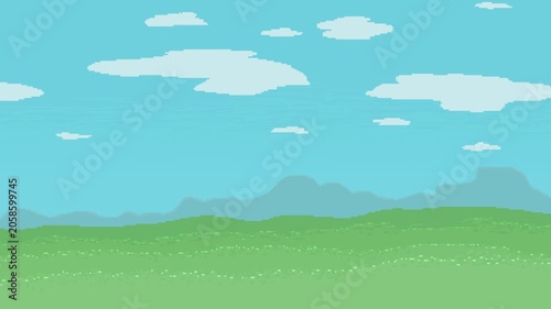  A sunny day in the background; mountains visible in the distance the grass glistens