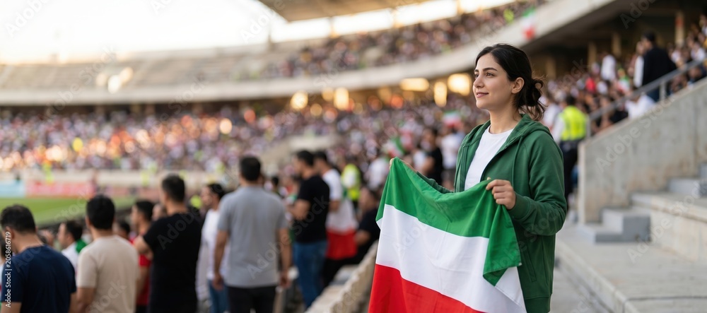 Fototapeta premium Female football supporter holding Iranian flag in stadium