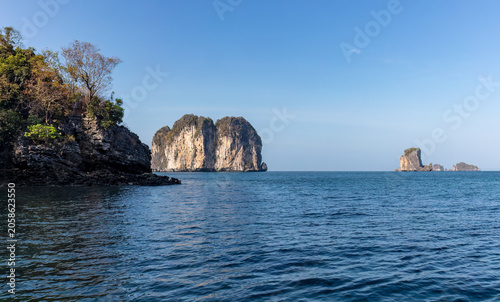 View of the Andaman Sea from an inlet of a tropical island near Krabi, southern Thailand. Other islands visible in the distance. 
