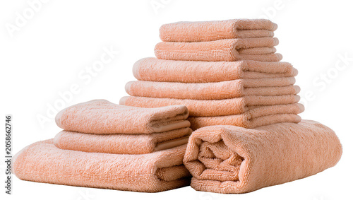 Tableau sur toile Neatly stacked peach colored terry cloth towels, isolated on transparent backgro