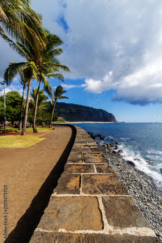 Volcanic stone wall on Indian Ocean coast - Barachois in Reunion island